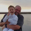 Mauka Hualalai Rentals owner with his son by the water