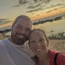 The Mauka Hualalai Rentals family on a Kona beach at sunset