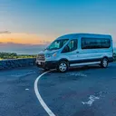 15-passenger Transit van on the Kona coast at sunset