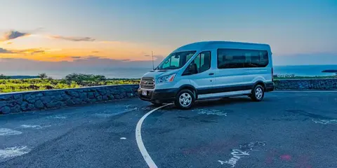 15-passenger Transit van on the Kona coast at sunset